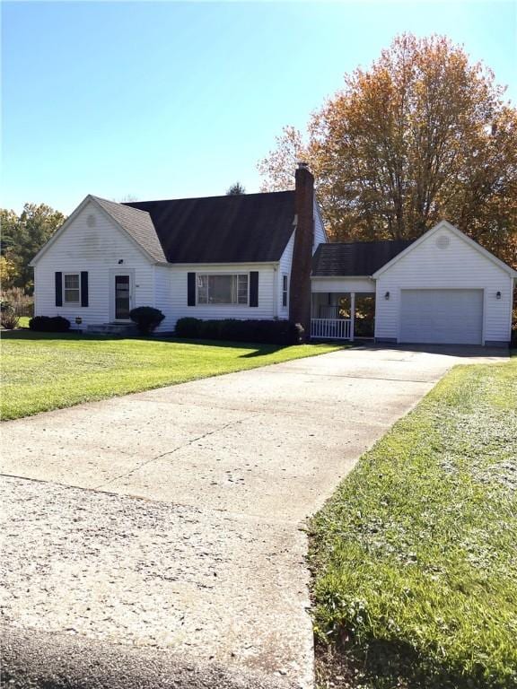 ranch-style house featuring a garage and a front yard