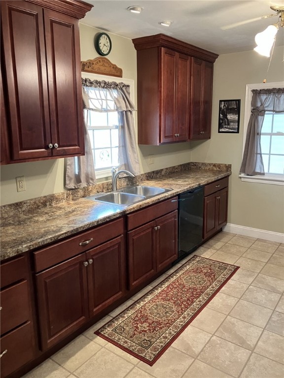 kitchen featuring ceiling fan, sink, light tile patterned floors, and black dishwasher