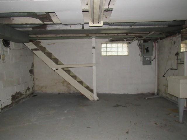 basement featuring sink and electric panel