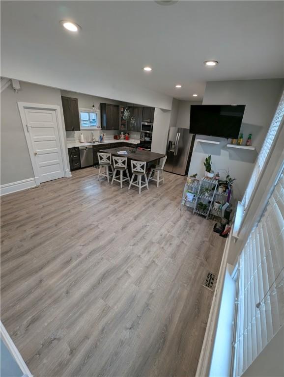 interior space featuring light wood-type flooring and sink