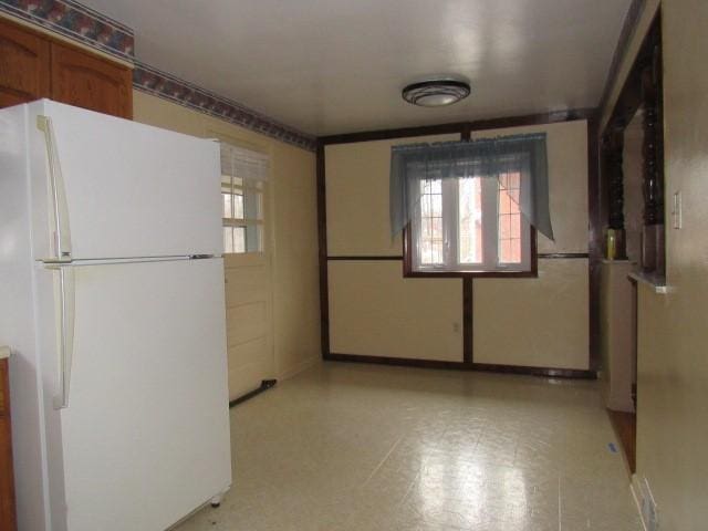 kitchen featuring white fridge