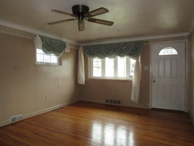 foyer with hardwood / wood-style flooring and ceiling fan