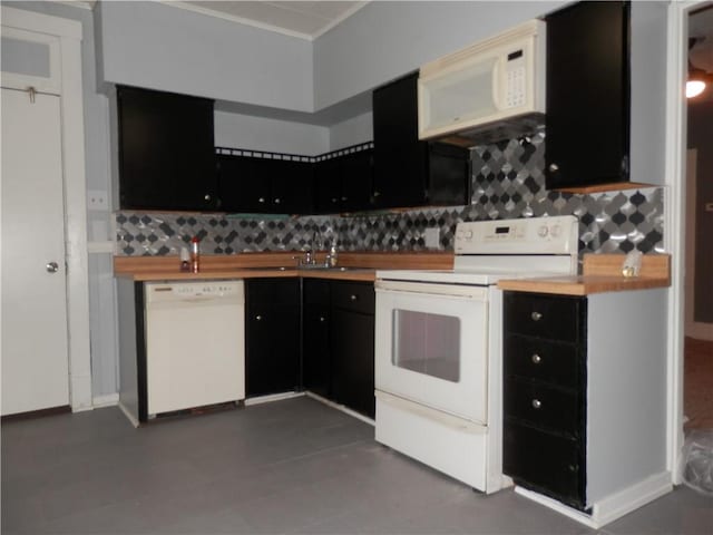 kitchen with wood counters, white appliances, sink, and backsplash