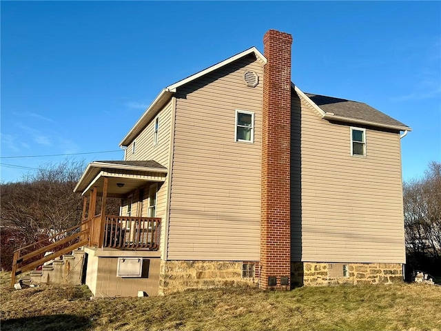 view of side of home featuring a lawn