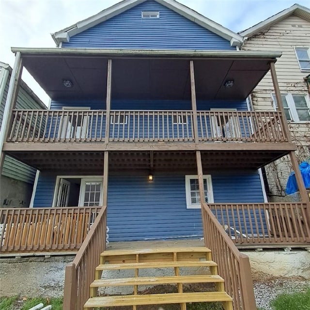 rear view of house with a deck