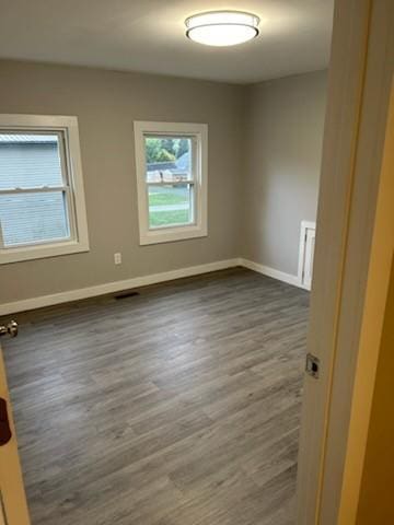 empty room with hardwood / wood-style floors