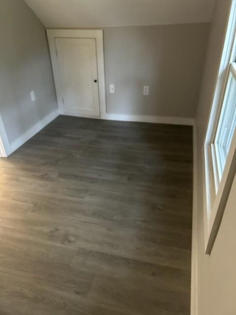 spare room featuring dark hardwood / wood-style floors