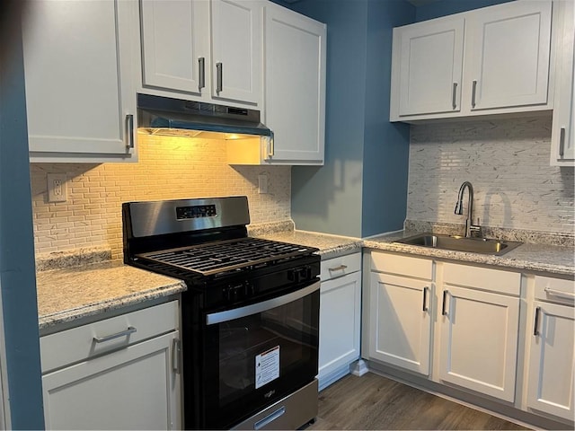 kitchen featuring backsplash, stainless steel range with gas cooktop, dark wood-type flooring, sink, and white cabinetry