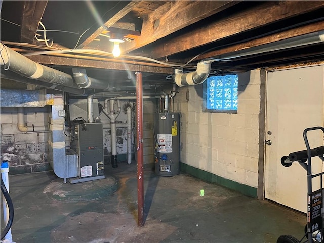 basement featuring heating unit and water heater