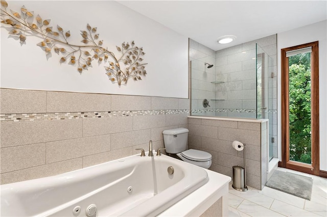 bathroom with independent shower and bath, tile walls, and toilet