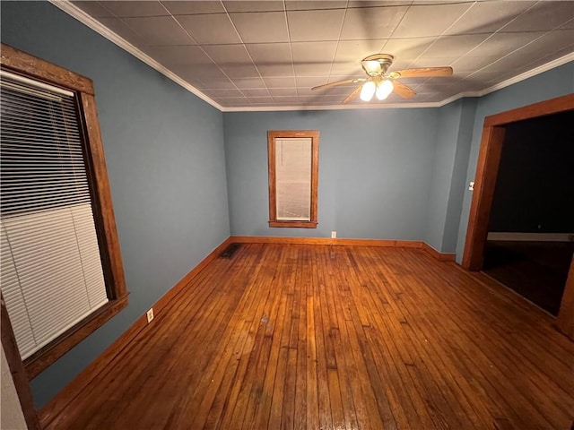 unfurnished room featuring ceiling fan, hardwood / wood-style floors, and ornamental molding