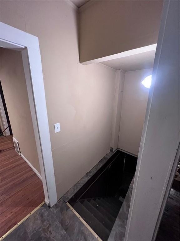 stairs featuring hardwood / wood-style floors