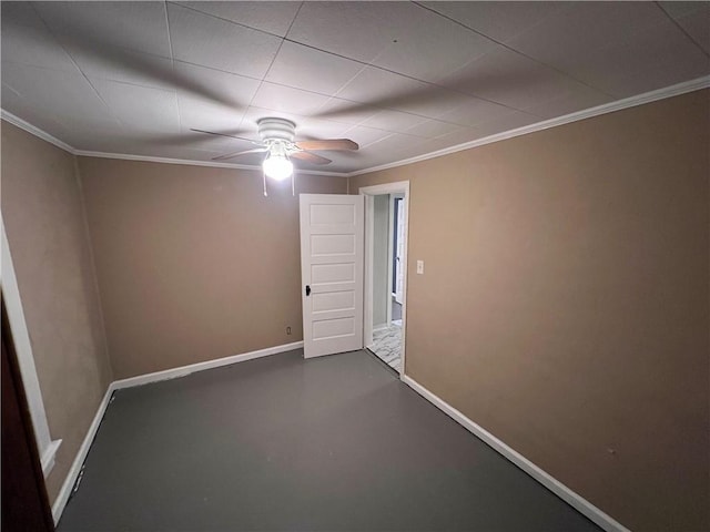 spare room featuring concrete flooring and ornamental molding