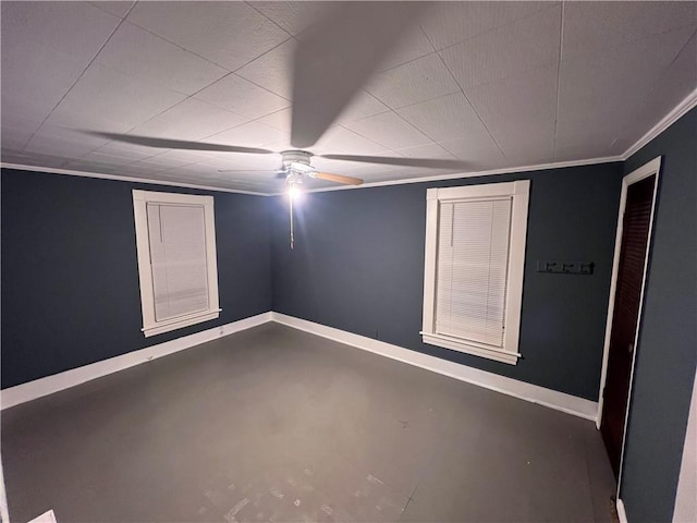 basement featuring ceiling fan and crown molding