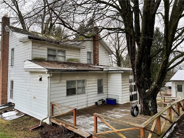 rear view of property with a wooden deck