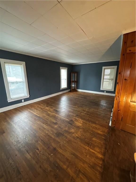 unfurnished room with dark hardwood / wood-style floors