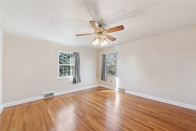 unfurnished room with ceiling fan and light hardwood / wood-style flooring