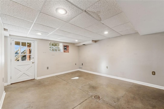 basement featuring a drop ceiling