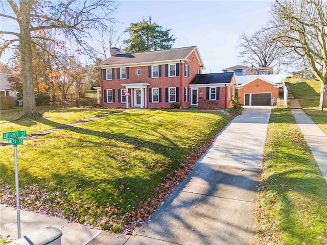 view of front of home with a garage and a front lawn