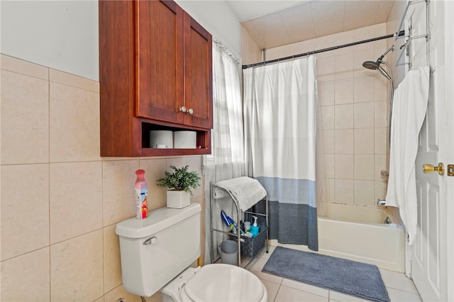 bathroom with tile patterned flooring, shower / tub combo, and tile walls