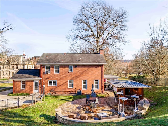 back of house with a yard and a patio area