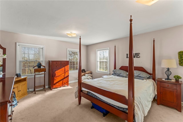 bedroom with light colored carpet