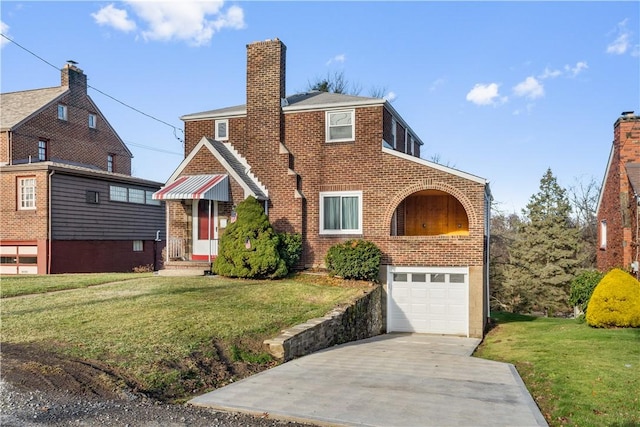 view of front facade with a front yard and a garage