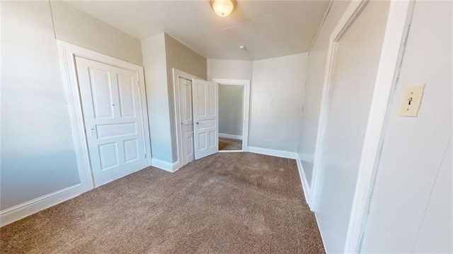 unfurnished bedroom with carpet floors