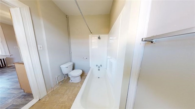 bathroom with toilet and tub / shower combination