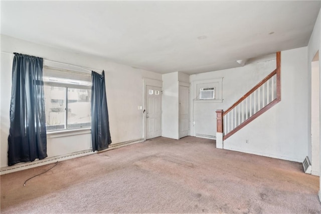 carpeted entryway featuring a wall unit AC