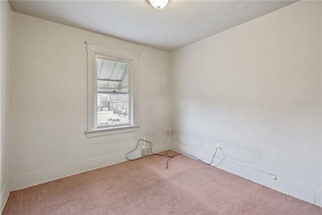 empty room with carpet flooring