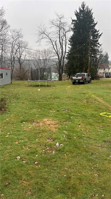 view of yard with a trampoline