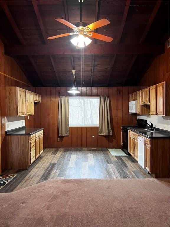 kitchen with vaulted ceiling with beams, dark hardwood / wood-style floors, wooden ceiling, and dishwashing machine