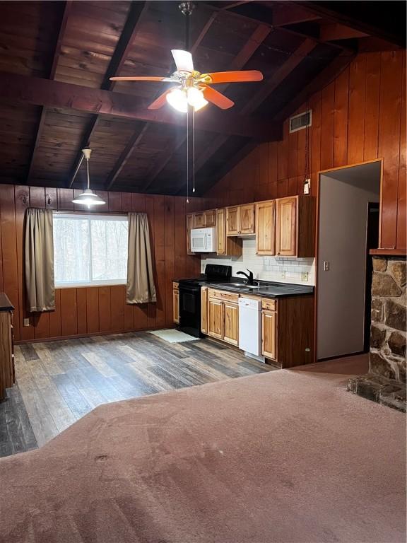 kitchen with backsplash, white appliances, ceiling fan, lofted ceiling with beams, and hardwood / wood-style floors