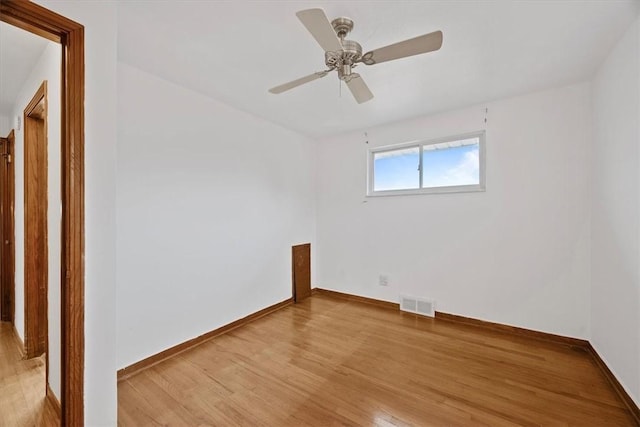 spare room featuring light hardwood / wood-style floors and ceiling fan