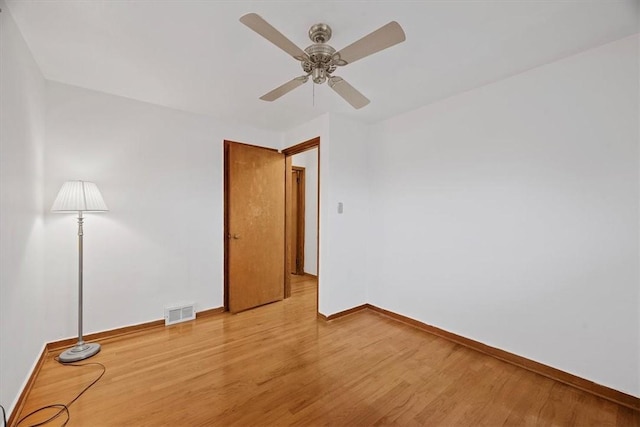 spare room with ceiling fan and light hardwood / wood-style flooring