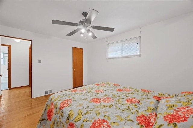 bedroom featuring ceiling fan and light hardwood / wood-style floors