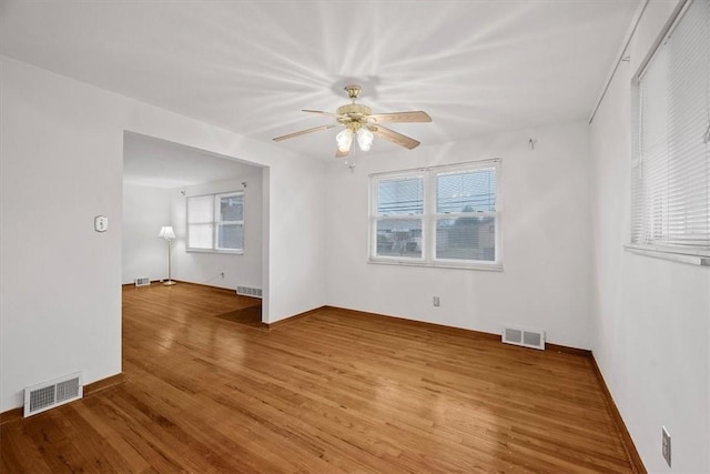 spare room with ceiling fan and wood-type flooring