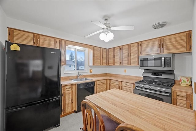 kitchen featuring wooden counters, sink, ceiling fan, and black appliances