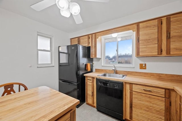 kitchen featuring black appliances, ceiling fan, and sink