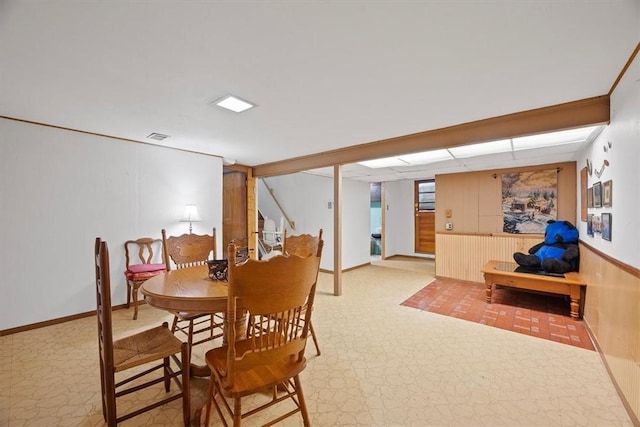 dining room featuring light carpet