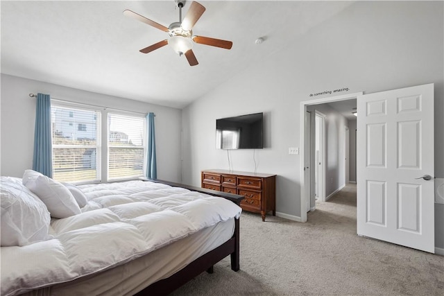 bedroom featuring ceiling fan, light colored carpet, and vaulted ceiling