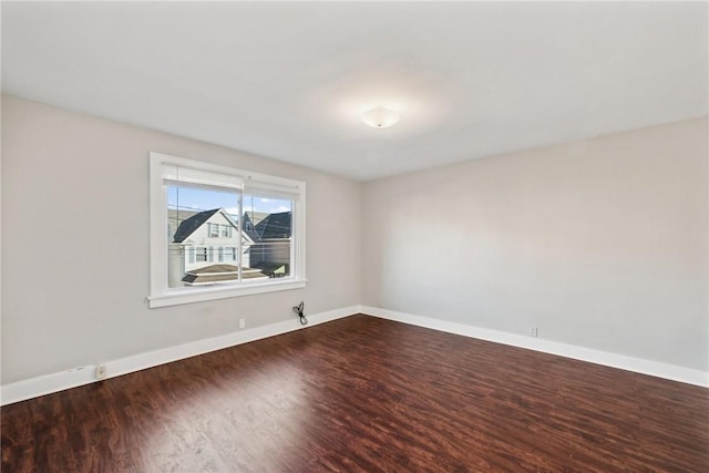 empty room featuring hardwood / wood-style flooring