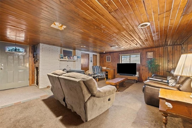 living room with carpet, brick wall, wooden walls, and wood ceiling