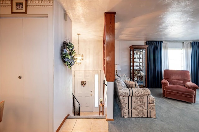 interior space featuring a notable chandelier and light carpet