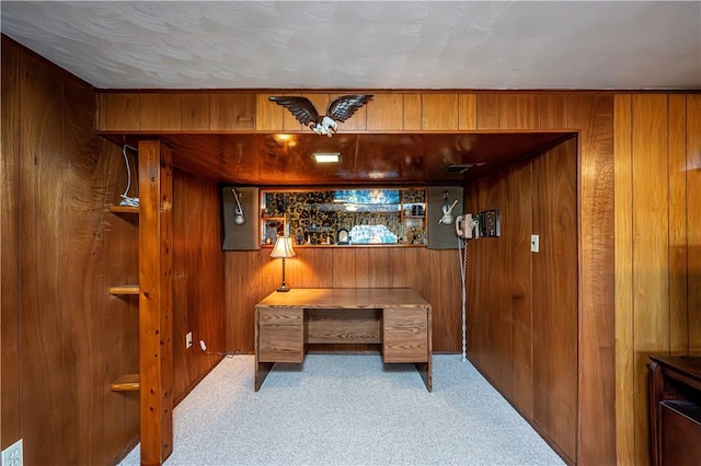 office with wooden walls and carpet