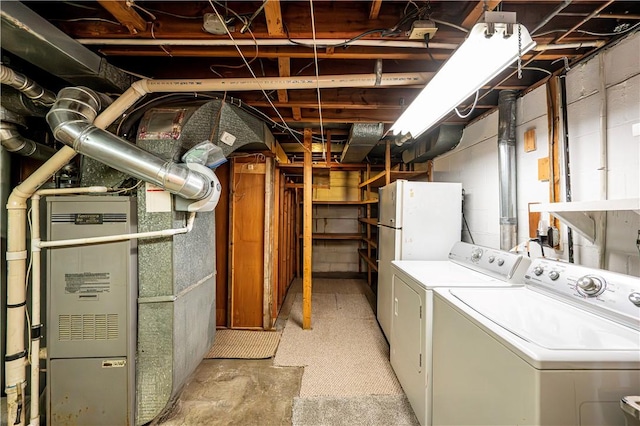 washroom with washing machine and clothes dryer