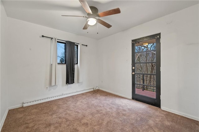 carpeted spare room featuring ceiling fan and a baseboard radiator