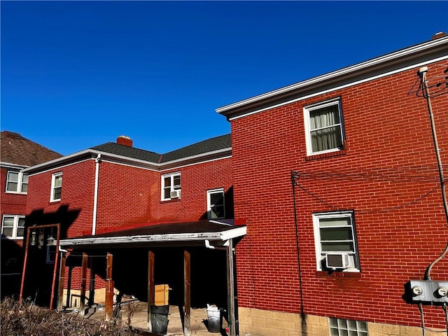 back of property featuring cooling unit