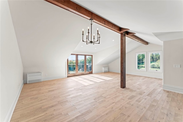 unfurnished living room featuring lofted ceiling with beams, light hardwood / wood-style floors, and a notable chandelier